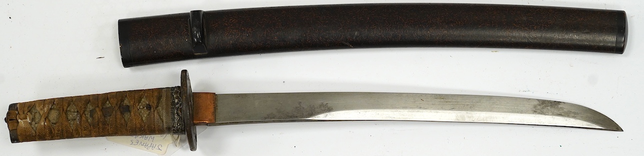 A 19th century Japanese wakizashi with scabbard, blade 31.5cm. Condition - fair, age worn overall
